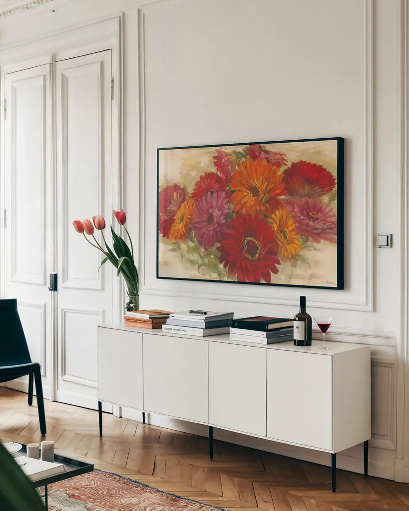 Summer Zinnias I by Carol Rowan. shown as a framed stretched canvas in a living room above a console. Available as a archival giclee rolled canvas, fine art paper, or poster print. SKU 41930i.