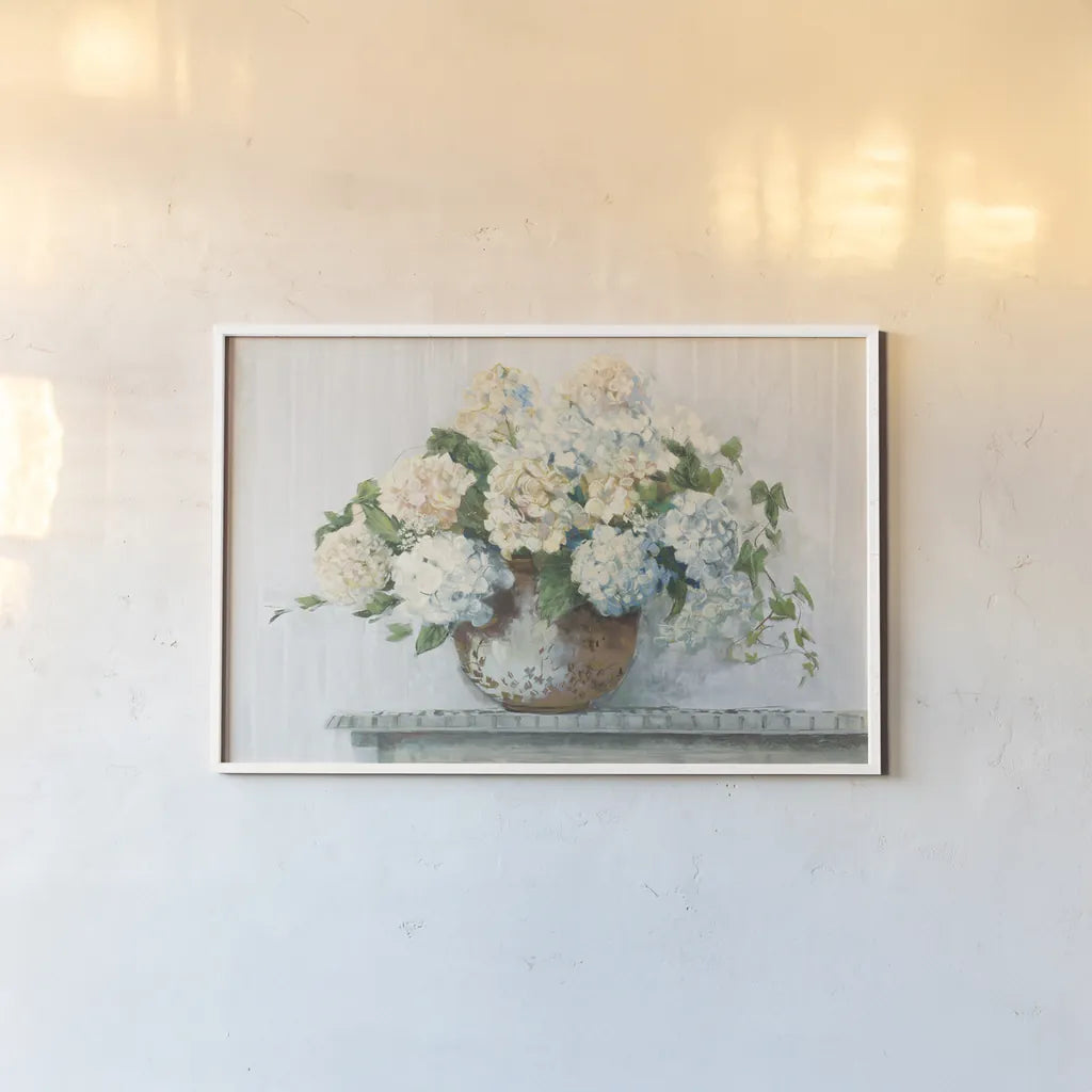 White Hydrangea Cottage by Carol Rowan. shown as a paper print in a white frame. Available as a archival giclee rolled canvas, fine art paper, or poster print. SKU 51425i.