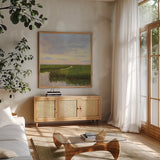 Brilliant Marsh Sunset by Carson Overstreet. Shown in a natural wood frame in a cozy modern living room. Available as an archival giclee rolled canvas, fine art paper, or poster print. SKU 99714a.