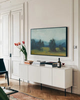 Fields and Mountains by Carson Overstreet. shown as a framed stretched canvas in a living room above a console. Available as a archival giclee rolled canvas, fine art paper, or poster print. SKU 97432i.