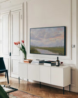 Misty Marsh Creek by Carson Overstreet. shown as a framed stretched canvas in a living room above a console. Available as a archival giclee rolled canvas, fine art paper, or poster print. SKU 99715i.