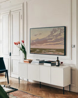 Softly Setting Sun by Carson Overstreet. shown as a framed stretched canvas in a living room above a console. Available as a archival giclee rolled canvas, fine art paper, or poster print. SKU 97430i.