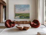 Winding Marsh Creek at Sundown by Carson Overstreet. Shown as extra-large giant wall art in a modern living room. Available as an archival giclee rolled canvas, fine art paper, or poster print. SKU 99337a.