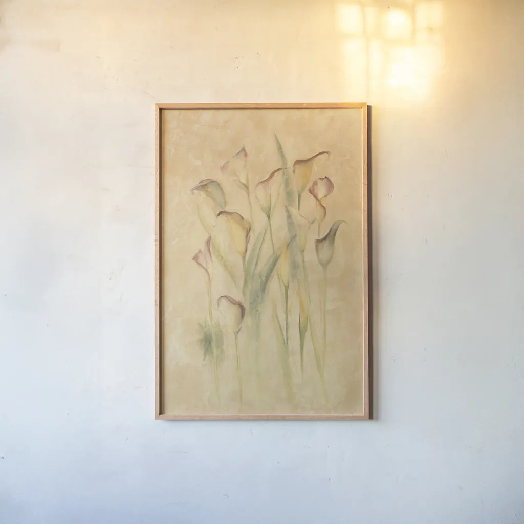 Blushing Calla Lilies by Cheri Blum. shown as a paper print in a natural frame. Available as a archival giclee rolled canvas, fine art paper, or poster print. SKU 7043h.