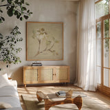 Dogwood Blossom by Cheri Blum. Shown in a natural wood frame in a cozy modern living room. Available as an archival giclee rolled canvas, fine art paper, or poster print. SKU 7020a.