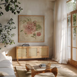 Dusty Pink Rose on Antique Linen Light by Cheri Blum. Shown in a natural wood frame in a cozy modern living room. Available as an archival giclee rolled canvas, fine art paper, or poster print. SKU 90528a.