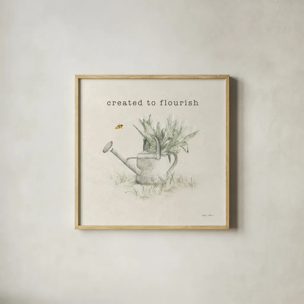Garden Watering Can Flourish by Cheri Blum. Shown in a natural wood glass frame for a timeless modern aesthetic. Available as an archival giclee rolled canvas, fine art paper, or poster print. SKU 91500a.