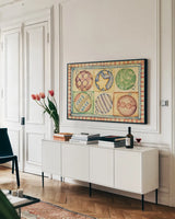 Holiday Ornaments by Cheri Blum. shown as a framed stretched canvas in a living room above a console. Available as a archival giclee rolled canvas, fine art paper, or poster print. SKU 90778i.