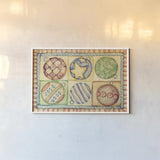 Holiday Ornaments by Cheri Blum. shown as a paper print in a white frame. Available as a archival giclee rolled canvas, fine art paper, or poster print. SKU 90778i.