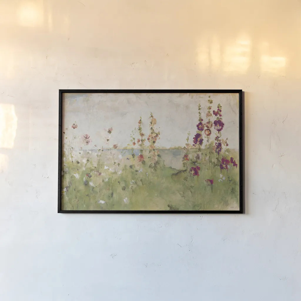 Hollyhocks by the Sea by Cheri Blum. shown as a paper print in a black flame. Available as a archival giclee rolled canvas, fine art paper, or poster print. SKU 8256i.