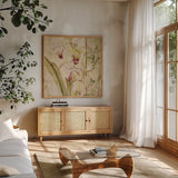 Orchids II Crop by Cheri Blum. Shown in a natural wood frame in a cozy modern living room. Available as an archival giclee rolled canvas, fine art paper, or poster print. SKU 90127a.