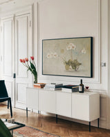 Orchids in a Chinese Bowl by Cheri Blum. shown as a framed stretched canvas in a living room above a console. Available as a archival giclee rolled canvas, fine art paper, or poster print. SKU 7110i.