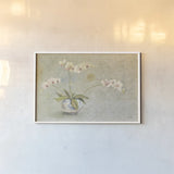 Orchids in a Porcelain Bowl by Cheri Blum. shown as a paper print in a white frame. Available as a archival giclee rolled canvas, fine art paper, or poster print. SKU 7629i.