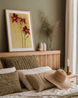 Red Day Lily by Cheri Blum. shown as a paper print in a natural frame. Available as a archival giclee rolled canvas, fine art paper, or poster print. SKU 7539h.