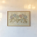 Row of Hydrangea by Cheri Blum. shown as a paper print in a natural frame. Available as a archival giclee rolled canvas, fine art paper, or poster print. SKU 16113i.