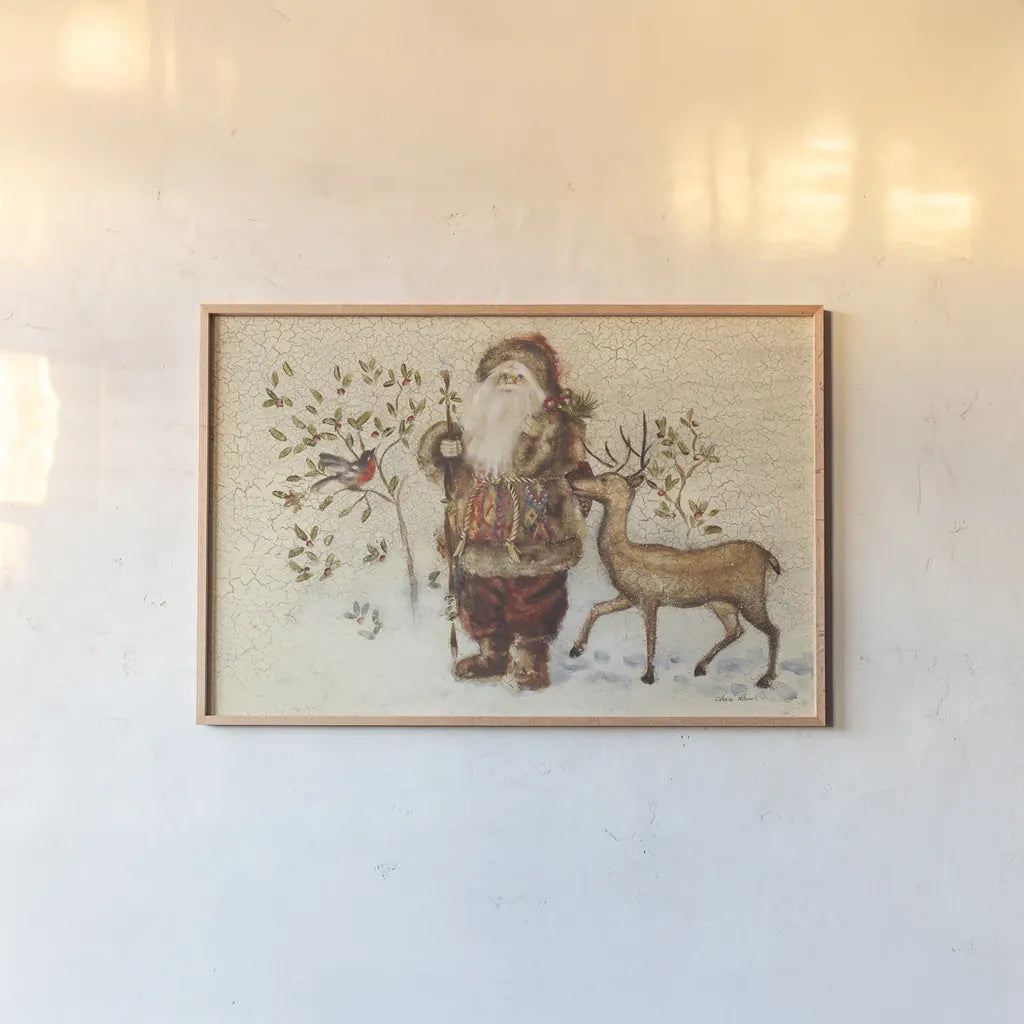 Santa with Deer by Cheri Blum. shown as a paper print in a natural frame. Available as a archival giclee rolled canvas, fine art paper, or poster print. SKU 90376i.