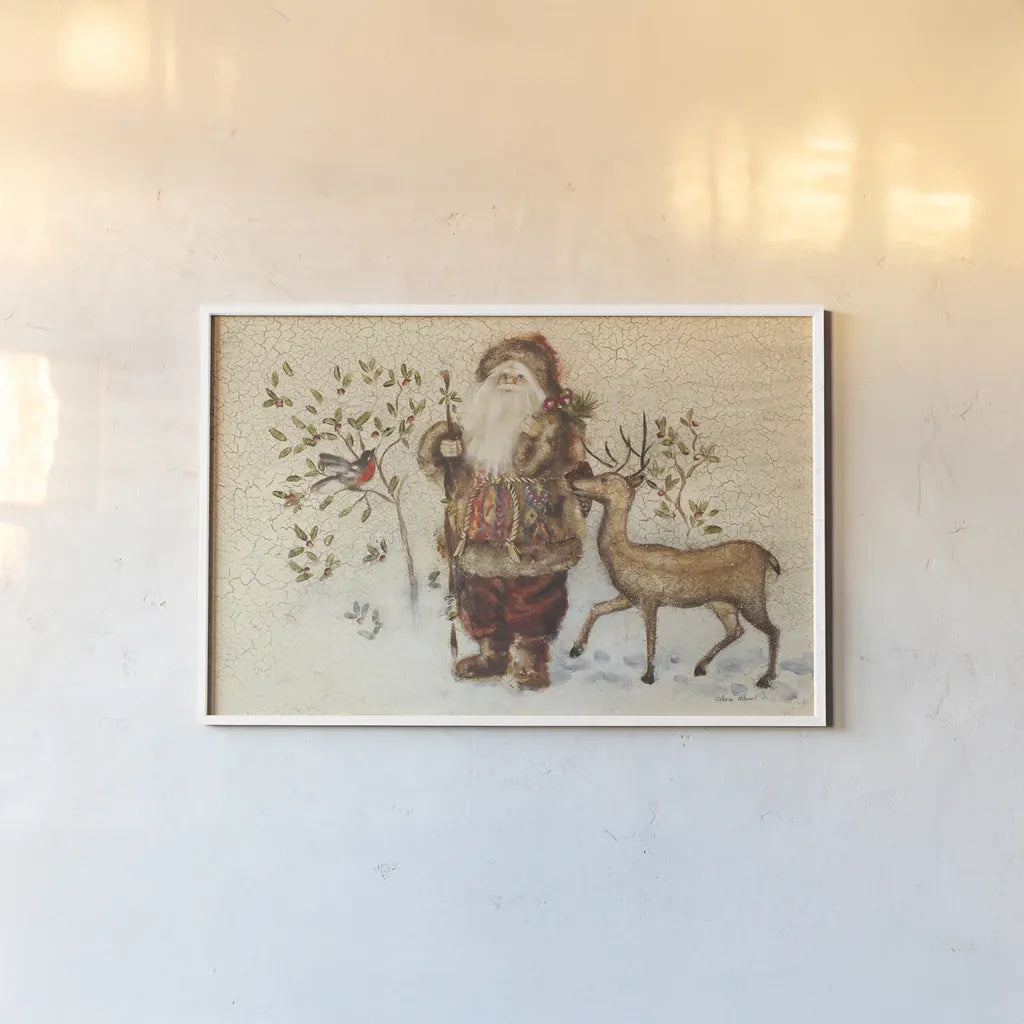 Santa with Deer by Cheri Blum. shown as a paper print in a white frame. Available as a archival giclee rolled canvas, fine art paper, or poster print. SKU 90376i.