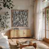 Cross Current Square Up I BW by Cheryl Warrick. Shown in a natural wood frame in a cozy modern living room. Available as an archival giclee rolled canvas, fine art paper, or poster print. SKU 25304a.