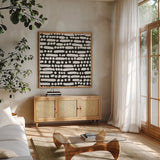 Cross Current Square Up III BW by Cheryl Warrick. Shown in a natural wood frame in a cozy modern living room. Available as an archival giclee rolled canvas, fine art paper, or poster print. SKU 25306a.