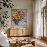 Geo Blooms by Cheryl Warrick. Shown in a natural wood frame in a cozy modern living room. Available as an archival giclee rolled canvas, fine art paper, or poster print. SKU 103250a.