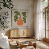 Potted Plants III by Cheryl Warrick. Shown in a natural wood frame in a cozy modern living room. Available as an archival giclee rolled canvas, fine art paper, or poster print. SKU 102640a.