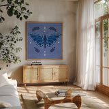 Simply Butterflies V by Cheryl Warrick. Shown in a natural wood frame in a cozy modern living room. Available as an archival giclee rolled canvas, fine art paper, or poster print. SKU 102965a.