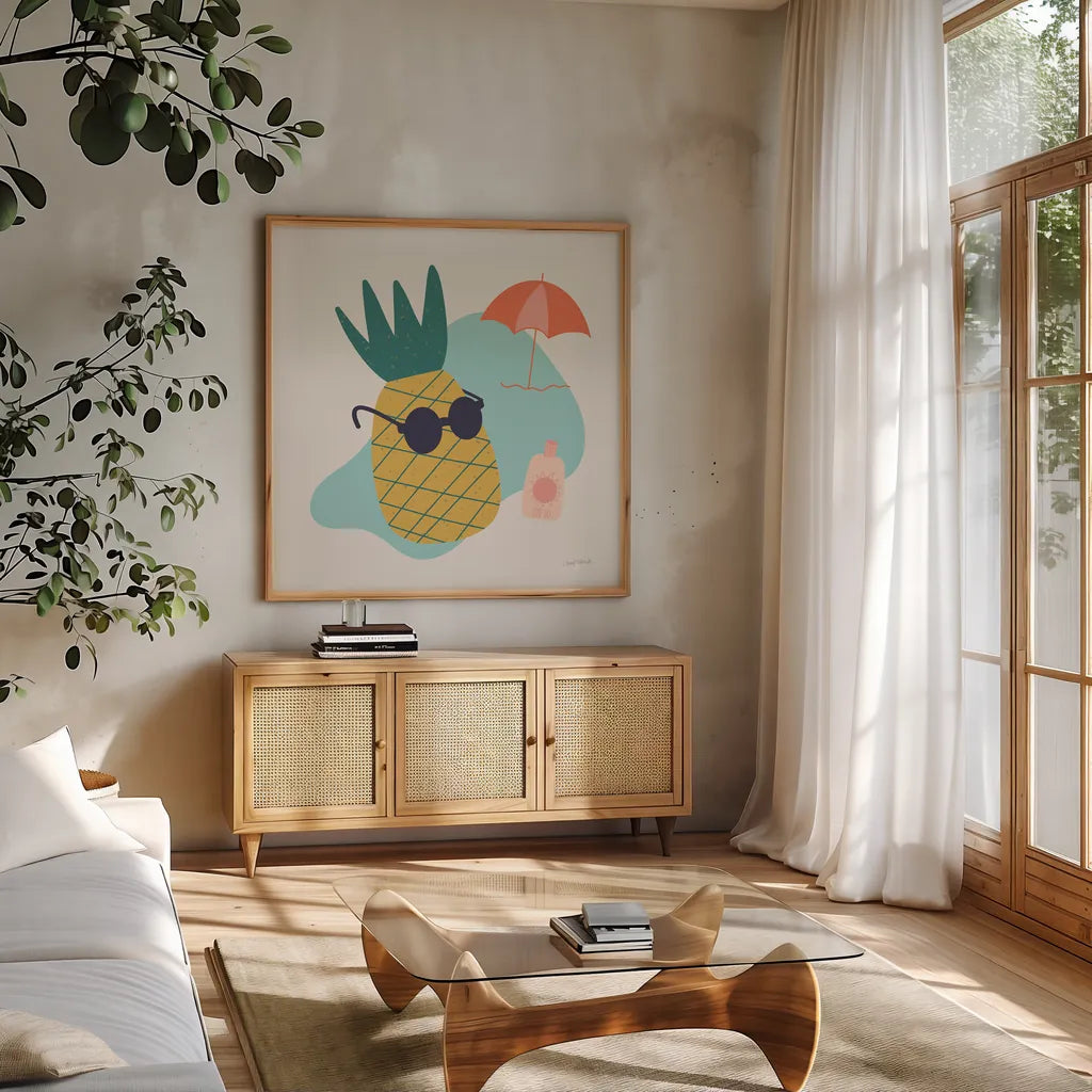 Sunny Pineapple I by Cheryl Warrick. Shown in a natural wood frame in a cozy modern living room. Available as an archival giclee rolled canvas, fine art paper, or poster print. SKU 82705a.
