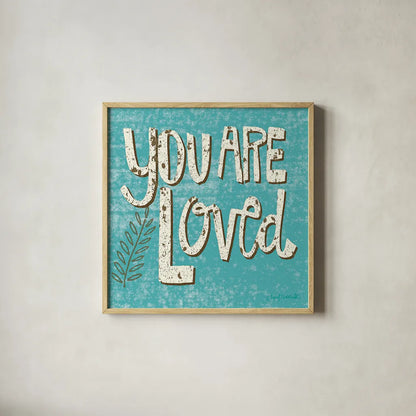 You are Loved by Cheryl Warrick. Shown in a natural wood glass frame for a timeless modern aesthetic. Available as an archival giclee rolled canvas, fine art paper, or poster print. SKU 18516a.