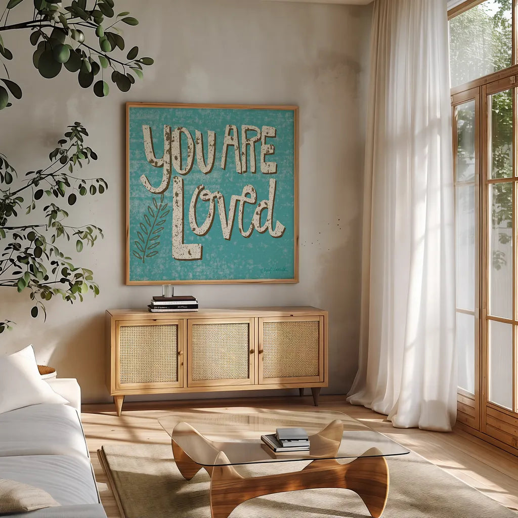 You are Loved by Cheryl Warrick. Shown in a natural wood frame in a cozy modern living room. Available as an archival giclee rolled canvas, fine art paper, or poster print. SKU 18516a.