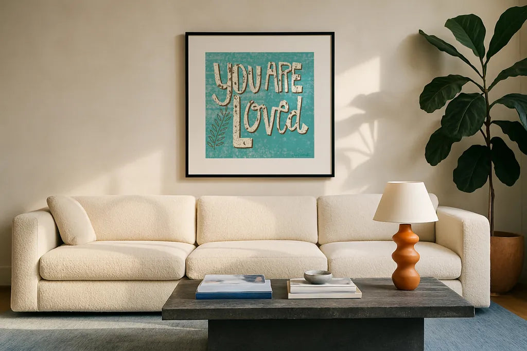 You are Loved by Cheryl Warrick. Displayed in a glass frame with matte in a clean modern living room. Available as an archival giclee rolled canvas, fine art paper, or poster print. SKU 18516a.
