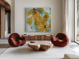 Amber Blue I by Chris Paschke. Shown as extra-large giant wall art in a modern living room. Available as an archival giclee rolled canvas, fine art paper, or poster print. SKU 59992a.