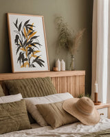 Amber Long Leaf I by Chris Paschke. shown as a paper print in a natural frame. Available as a archival giclee rolled canvas, fine art paper, or poster print. SKU 76328h.