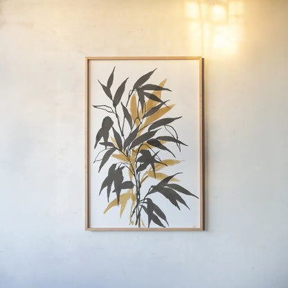 Amber Long Leaf I by Chris Paschke. shown as a paper print in a natural frame. Available as a archival giclee rolled canvas, fine art paper, or poster print. SKU 76328h.