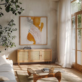 Amber Wash II by Chris Paschke. Shown in a natural wood frame in a cozy modern living room. Available as an archival giclee rolled canvas, fine art paper, or poster print. SKU 71908a.