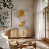 Amber Wash III by Chris Paschke. Shown in a natural wood frame in a cozy modern living room. Available as an archival giclee rolled canvas, fine art paper, or poster print. SKU 71909a.