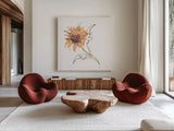 Apricot Sunflower I by Chris Paschke. Shown as extra-large giant wall art in a modern living room. Available as an archival giclee rolled canvas, fine art paper, or poster print. SKU 91438a.
