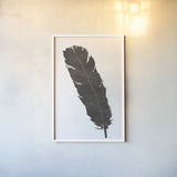 Black Feather V by Chris Paschke. shown as a paper print in a white frame. Available as a archival giclee rolled canvas, fine art paper, or poster print. SKU 28001h.