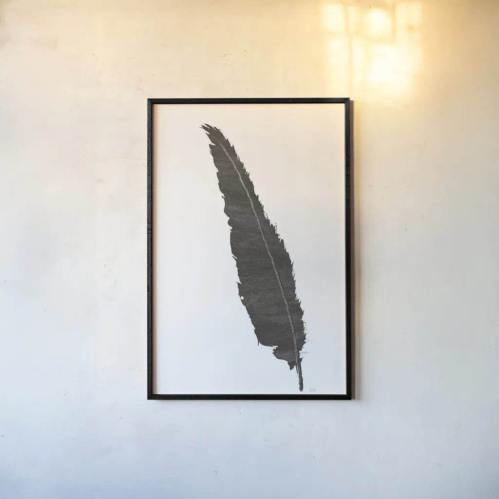 Black Feather VI by Chris Paschke. shown as a paper print in a black flame. Available as a archival giclee rolled canvas, fine art paper, or poster print. SKU 28002h.