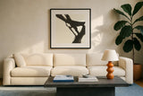 Black Gesture I by Chris Paschke. Displayed in a glass frame with matte in a clean modern living room. Available as an archival giclee rolled canvas, fine art paper, or poster print. SKU 69344a.