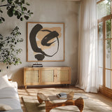 Black and Cream I by Chris Paschke. Shown in a natural wood frame in a cozy modern living room. Available as an archival giclee rolled canvas, fine art paper, or poster print. SKU 83767a.