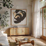 Black and Cream II by Chris Paschke. Shown in a natural wood frame in a cozy modern living room. Available as an archival giclee rolled canvas, fine art paper, or poster print. SKU 83768a.