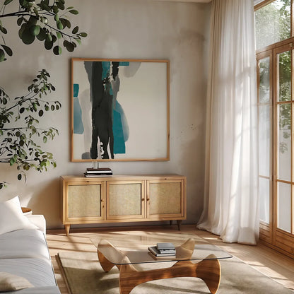 Black and Teal II by Chris Paschke. Shown in a natural wood frame in a cozy modern living room. Available as an archival giclee rolled canvas, fine art paper, or poster print. SKU 34092a.