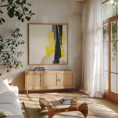 Black and Yellow I by Chris Paschke. Shown in a natural wood frame in a cozy modern living room. Available as an archival giclee rolled canvas, fine art paper, or poster print. SKU 32533a.