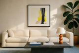 Black and Yellow I by Chris Paschke. Displayed in a glass frame with matte in a clean modern living room. Available as an archival giclee rolled canvas, fine art paper, or poster print. SKU 32533a.
