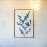 Blue Branch II by Chris Paschke. shown as a paper print in a natural frame. Available as a archival giclee rolled canvas, fine art paper, or poster print. SKU 55060h.