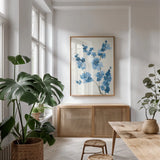 Blue Branch IV by Chris Paschke. shown as a print in a natural wood frame in a dining room. Available as a archival giclee rolled canvas, fine art paper, or poster print. SKU 55062h.