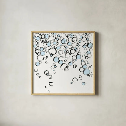 Blue Bubbles III by Chris Paschke. Shown in a natural wood glass frame for a timeless modern aesthetic. Available as an archival giclee rolled canvas, fine art paper, or poster print. SKU 75525a.