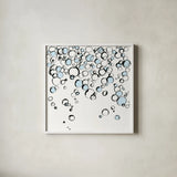 Blue Bubbles III by Chris Paschke. Shown in a crisp white glass frame for a clean and minimalist style. Available as an archival giclee rolled canvas, fine art paper, or poster print. SKU 75525a.