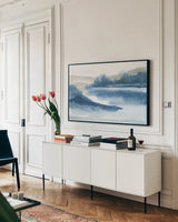 Blue Fog I by Chris Paschke. shown as a framed stretched canvas in a living room above a console. Available as a archival giclee rolled canvas, fine art paper, or poster print. SKU 83105i.