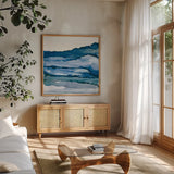 Blue Grayscape III by Chris Paschke. Shown in a natural wood frame in a cozy modern living room. Available as an archival giclee rolled canvas, fine art paper, or poster print. SKU 68785a.